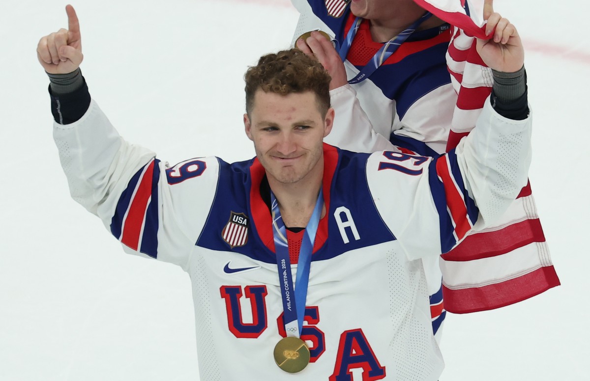 epa12769058 Gold medalist Matthew Tkachuk of USA poses on the ice after the medal ceremony for the Men's Ice Hockey at the Milano Cortina 2026 Winter Olympic Games in Milano, Italy, 22 February 2 ...