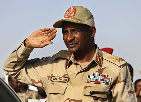 TILE - General Mohammed Hamdan Dagalo, then deputy head of the military council, salutes at a rally in Galawee, North Sudan, June 15, 2019. Four years ago, a popular uprising in Sudan aided the depo...