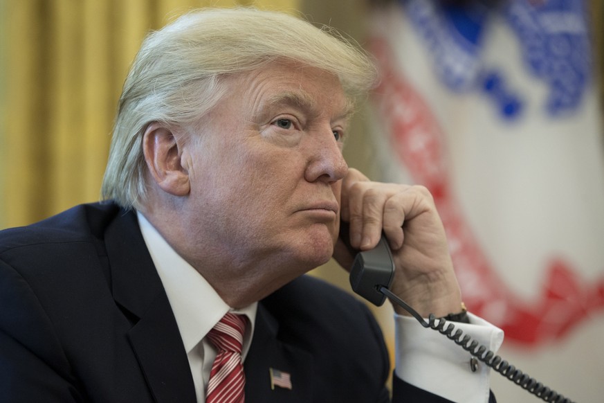 epa07873310 (FILE) - US President Donald J. Trump makes a phone call to Prime Minister of Ireland to Leo Varadkar in the Oval Office of the White House in Washington, DC, USA, 27 June 2017 (reissued 2 ...