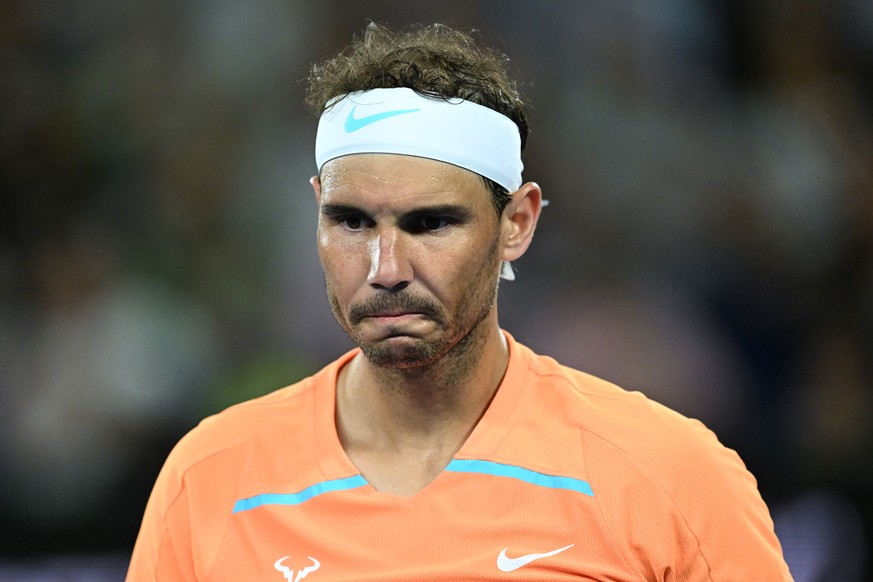 epa10412371 Rafael Nadal of Spain reacts while in action against Mackenzie McDonald of the USA during their match at the 2023 Australian Open tennis tournament at Melbourne Park in Melbourne, Australi ...