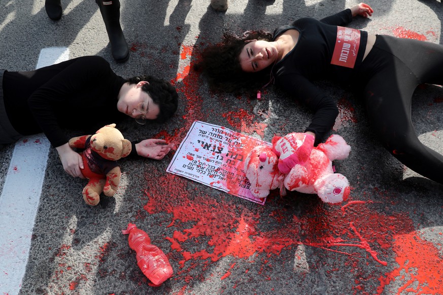 epa07207515 Women block the main entrance to Jerusalem as part of a national violence against women protest in Jerusalem, Israel, 04 December 2018. Violence against women organizers call for a nationw ...