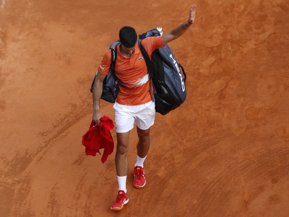 epaselect epa09886269 Novak Djokovic of Serbia leaves the court after losing his second round match against Alejandro Davidovich Fokina of Spain at the Monte-Carlo Rolex Masters tennis tournament in R ...
