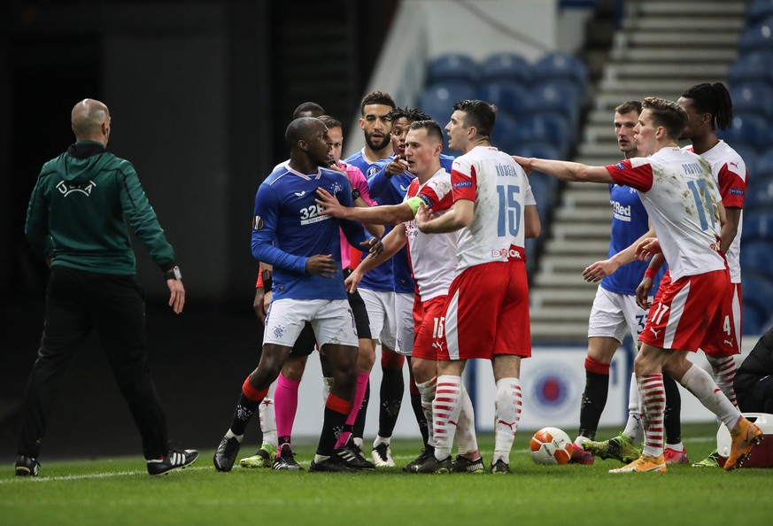 epa09083038 Glen Kamara (L) of Rangers argues with Ondrej Kudela (C) of Prague during the UEFA Europa League Round of 16, second leg match between Glasgow Rangers and Slavia Prague in Glasgow, Britain ...