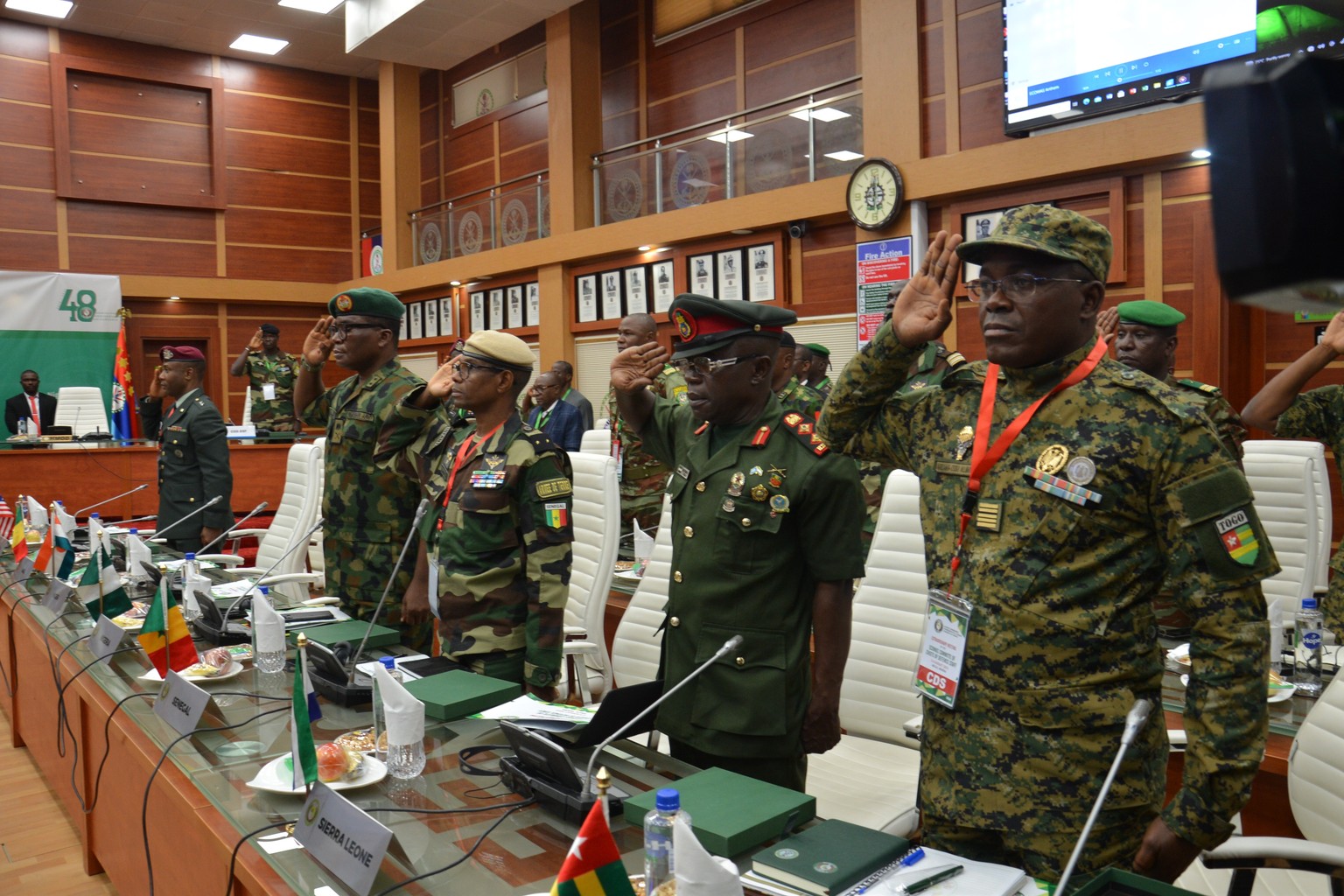 epaselect epa10781629 The Chiefs of Defence Staff from ECOWAS countries salute at the start of the Extraordinary Meeting of the ECOWAS Committee of Chief of Defence Staff on the Political Situation in ...