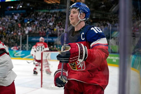 Czechia's Roman Cervenka (10) skates behind the net after scoring a goal against Denmark during the second period of a men's ice hockey qualification playoff game at the 2026 Winter Olympics ...