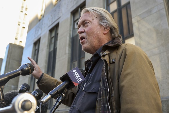 epa11717173 Former Trump Advisor Steve Bannon speaks to the press outside a criminal courthouse after appearing in a hearing before an upcoming trial on criminal fraud charges, in New York, New York,  ...