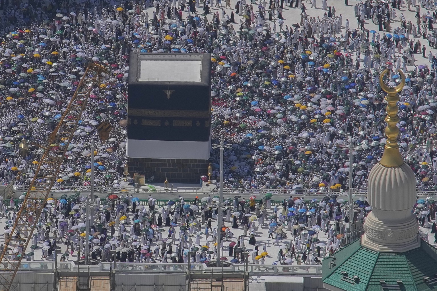 Muslim pilgrims circumambulate the Kaaba, the cubic building at the Grand Mosque, during the annual Hajj pilgrimage in Mecca, Saudi Arabia, Monday, June 17, 2024. Muslim pilgrims used the early mornin ...
