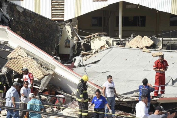 Rescue workers search for survivors amid debris after the roof of a church collapsed during a Sunday Mass in Ciudad Madero, Mexico, Sunday, Oct. 1, 2023. The Bishop of the Roman Catholic Diocese of Ta ...