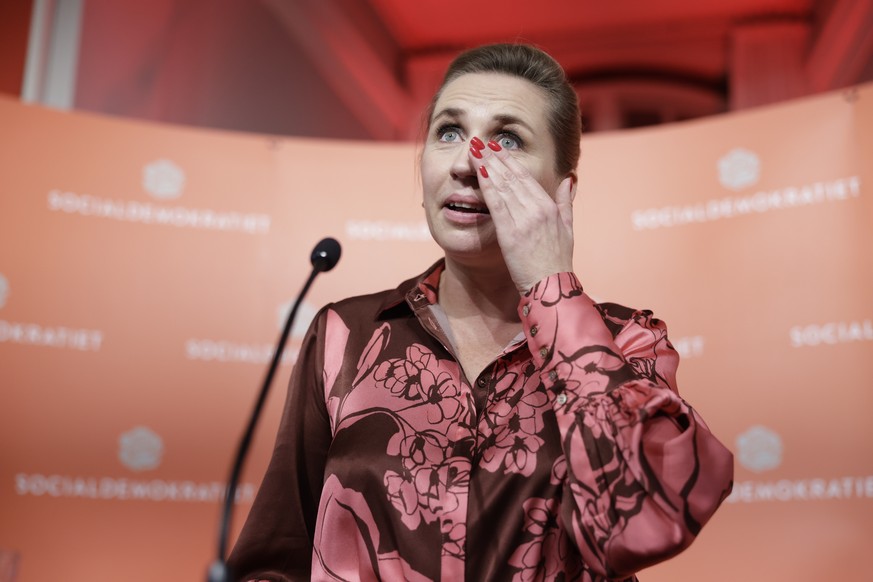 epa10280600 Denmark&#039;s Prime Minister and head of the the Social Democratic Party Mette Frederiksen reacts before giving a speech during the election night at the Social Democratic Party election  ...