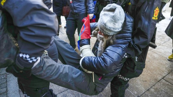 Swedish activist Greta Thunberg is carried away during a protest outside the Norwegian Ministry of Finance, in Oslo, Wednesday, March 1, 2023. Climate activists demonstrated for a third consecutive da ...