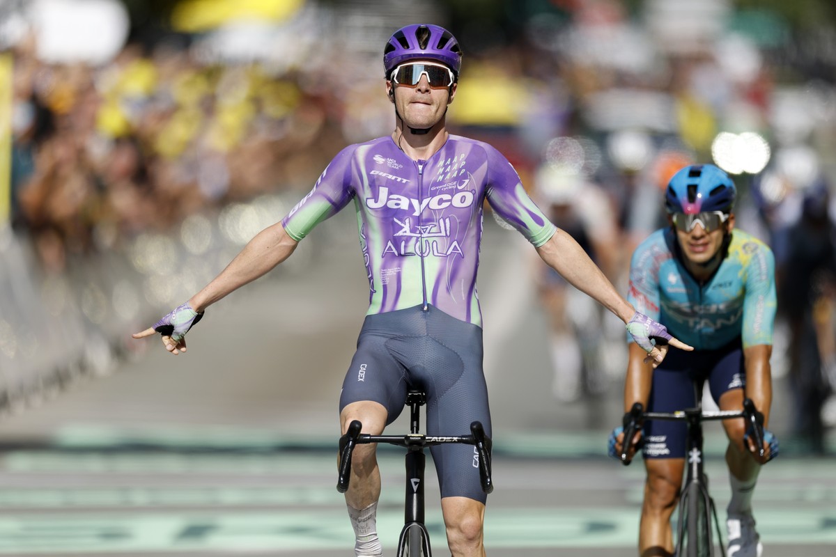 KEYPIX - epa13117432 Swiss cyclist Mauro Schmid of Team Jayco AlUla celebrates as he crosses the finish line to win Stage 13 of the Tour de France, a 205.8 km route from Dole to Belfort, France, 17 Ju ...