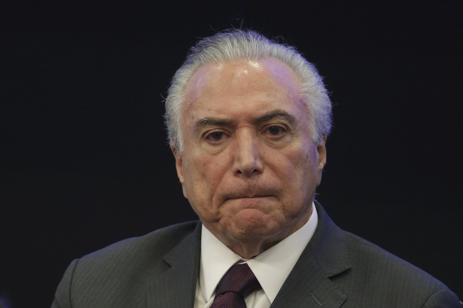 Brazil&#039;s President Michel Temer listens in during a event at the Brazilian Institute of Research in Brasilia, Brazil, Monday, May 8, 2017. A year after taking power amid a bitter impeachment batt ...