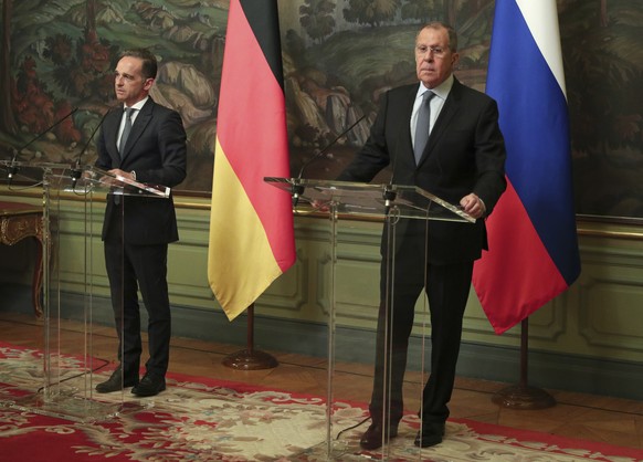 epa08597125 A handout photo made available by the Russian Ministry of Foreign Affairs shows Russian Foreign Minister Sergei Lavrov (R) and his German counterpart Heiko Maas (L), during their press con ...