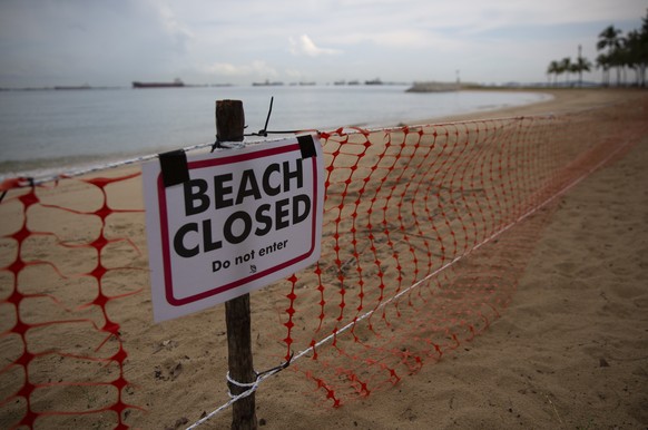 epa08358540 A view of a closed public beach at East Coast Park in Singapore, 12 April 2020. Singapore closed all beaches to the public on 11 April as part of the measures to prevent the spread of coro ...