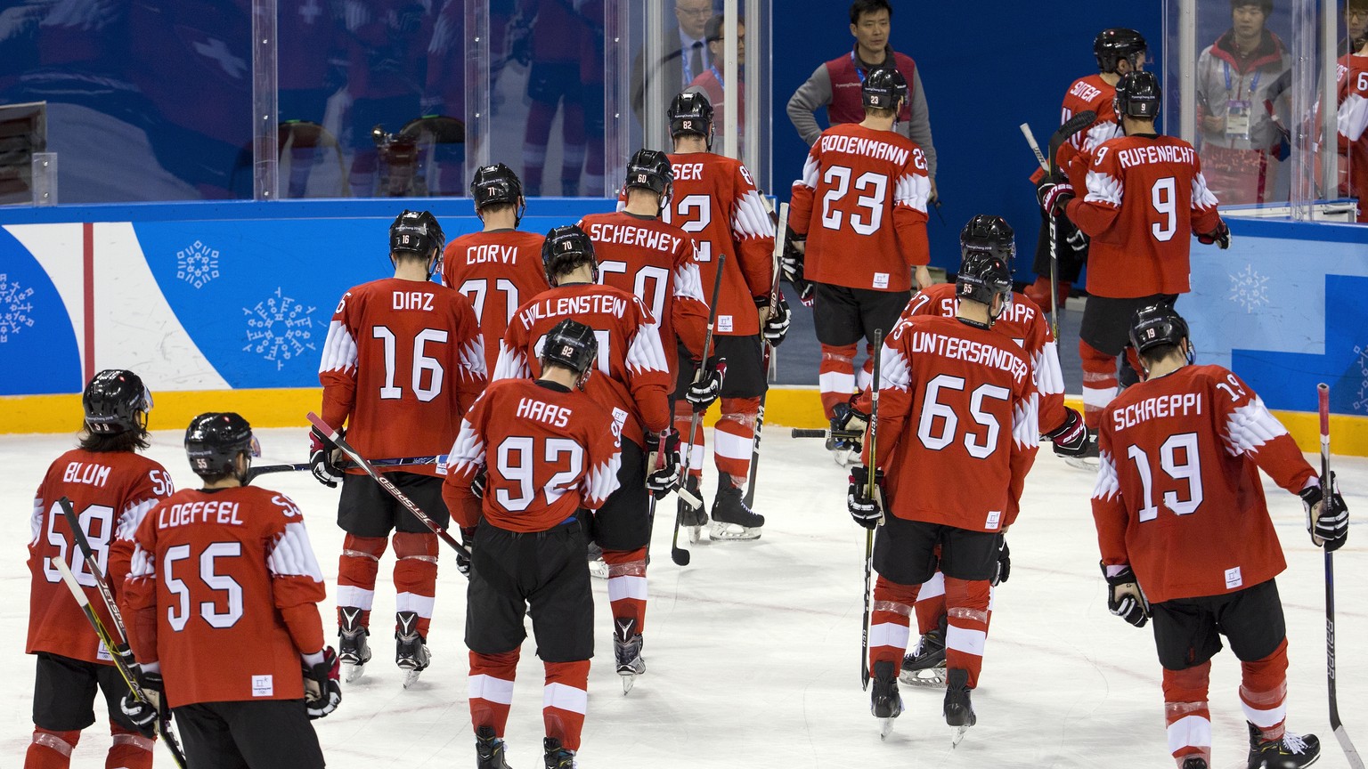 Players of Switzerland react after the men ice hockey play-off qualification match between Switzerland and Germany in the Kwandong Hockey Center in Gangneung during the XXIII Winter Olympics 2018 in P ...