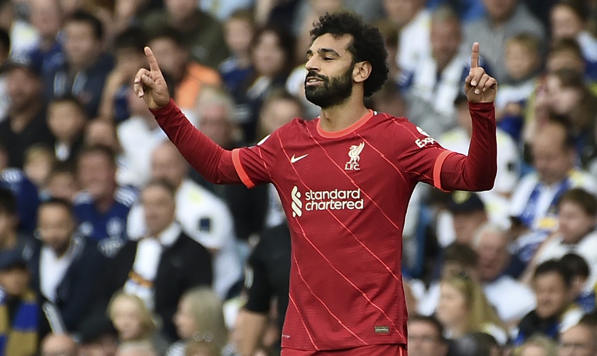 Liverpool's Mohamed Salah celebrates after scoring the opening goal during the English Premier League soccer match between Leeds United and Liverpool at Elland Road, Leeds, England, Sunday, Sept. ...