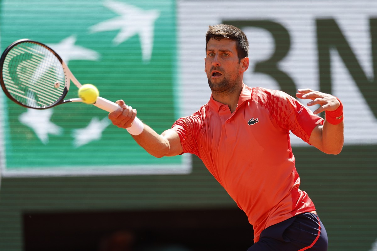 Serbia's Novak Djokovic plays a shot against Aleksandar Kovacevic of the U.S. during their first round match of the French Open tennis tournament at the Roland Garros stadium in Paris, Monday, Ma ...