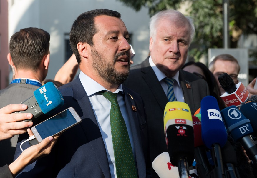 epa06881237 Italian Interior Minister Matteo Salvini (L) and German Interior Minister Horst Seehofer during a statement after their meeting prior to the informal meeting of justice and home affairs mi ...