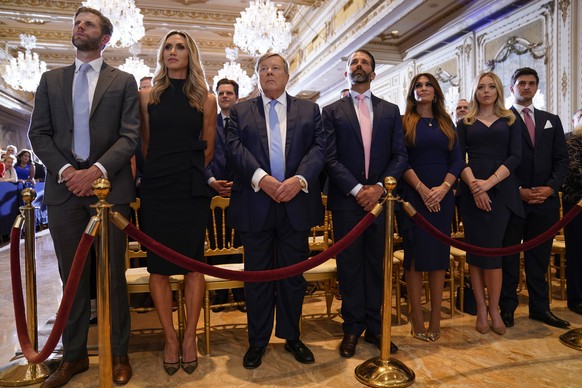 From left, Eric Trump and his wife Lara, Victor Knavs, Donald Trump Jr., and his fianc