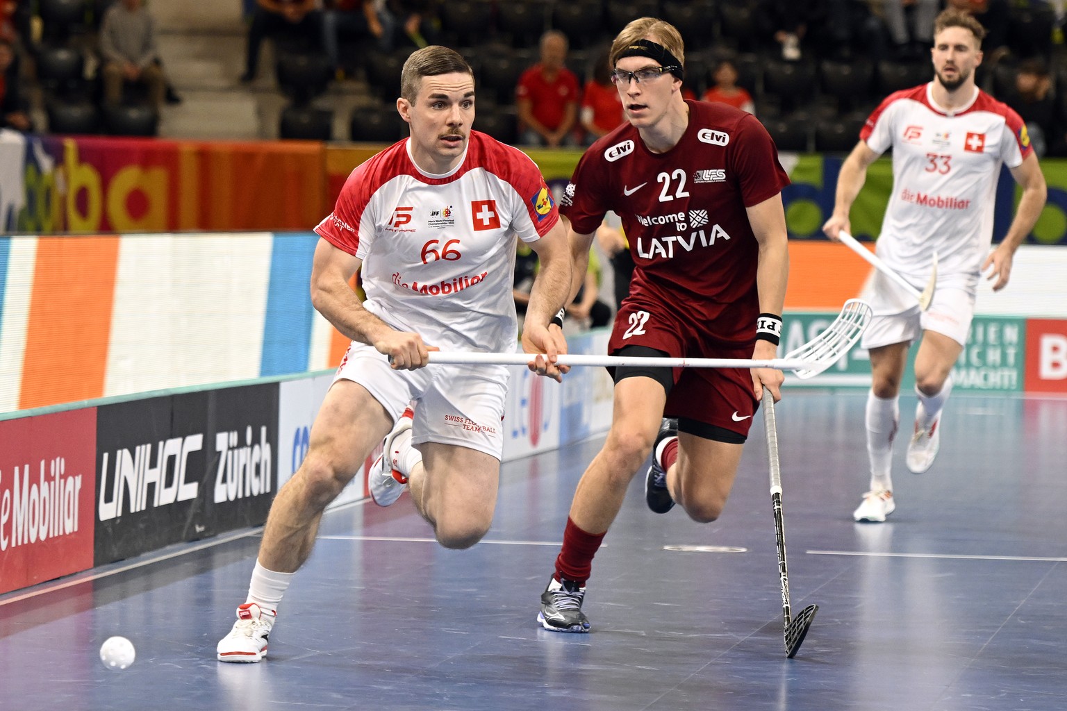 Switzerland&#039;s Tim Braillard left, and Latvia�s, Peteris Trekse, right, in action during the 14th Men&#039;s World Floorball Championships Quarter Final match between Switzerland and Latvia in Zur ...