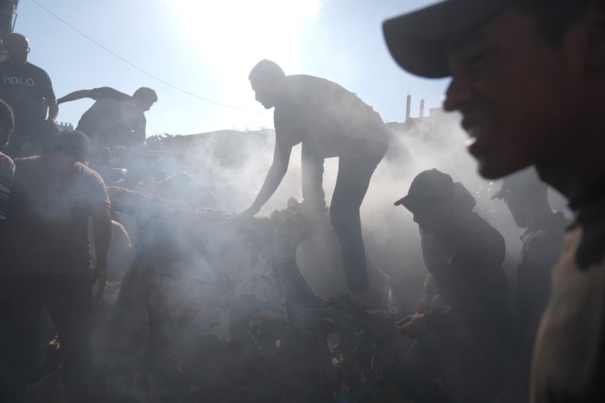 People operate on a destroyed vehicle following an Israeli airstrike in Gaza city, Saturday, Sept. 19, 2026. (AP Photo/Jehad Alshrafi)
Israel Palestinians Gaza