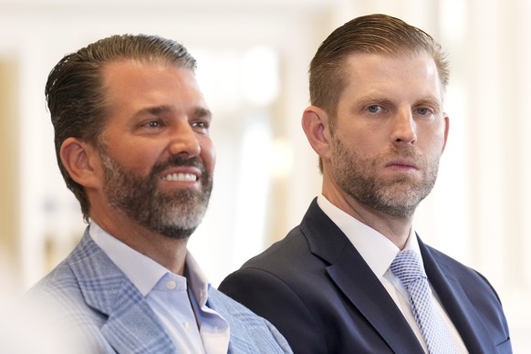 Donald Trump Jr. and Eric Trump attend the meeting between President Donald Trump and European Commission President Ursula von der Leyen at the Trump Turnberry golf course in Turnberry, Scotland Sunda ...