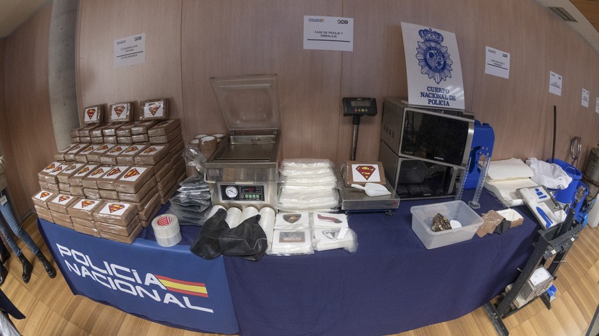 epa10570587 The material seized during an operation carried out by Spain&#039; National Police and Portugal&#039;s Judicial Police sits on a table during a press conference in Madrid, Spain, 13 April  ...