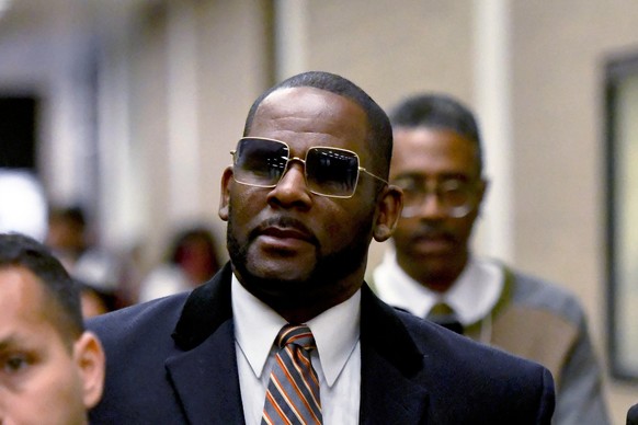 FILE - R. Kelly leaves the Daley Center after a hearing in his child support case May 8, 2019, in Chicago. Minnesota prosecutors dropped sex abuse charges on Tuesday, May 16, 2023, against disgraced R ...