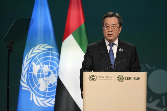 Chinese Vice Premier Ding Xuexiang speaks during a plenary session at the COP28 U.N. Climate Summit, Friday, Dec. 1, 2023, in Dubai, United Arab Emirates. (AP Photo/Rafiq Maqbool)