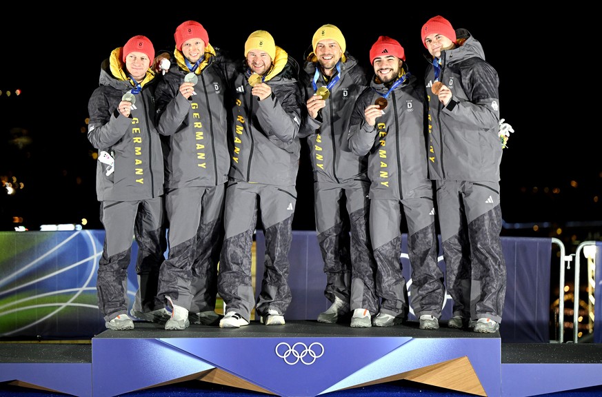 epa12751978 Silver medalists Francesco Friedrich (L) and Alexander Schuller (2L of Germany, gold medalists Johannes Lochner (CL) and Georg Fleischhauer (CR) of Germany and Bronze medalists Adam Ammour ...