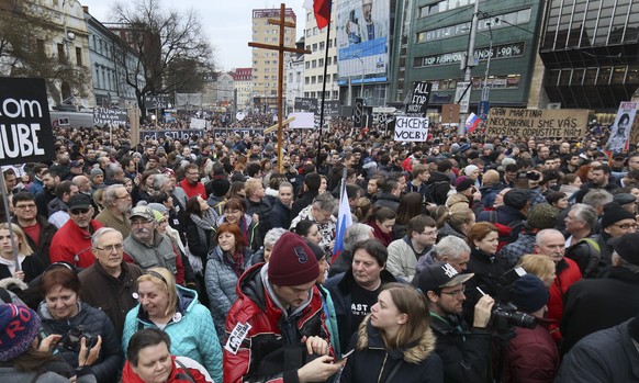 People gather on a square during an anti-government rally in Bratislava, Slovakia, Friday, March 9, 2018. The country-wide protests demand a thorough investigation into the shooting deaths of Jan Kuci ...