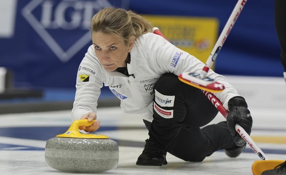 Switzerland's skip Silvana Tirinzoni releases the stone during the semifinal match against China at the World Women's Curling Championship in Uijeongbu, South Korea, Saturday, March 22, 2025 ...