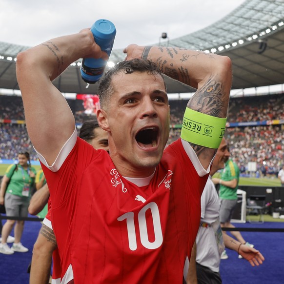 Switzerland&#039;s Granit Xhaka celebrates winning 2:0 against Italy after a round of 16 match between Switzerland and Italy at the Euro 2024 soccer tournament in Berlin, Germany, Saturday, June 29, 2 ...