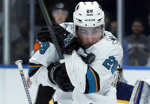 San Jose Sharks&#039; Timo Meier, of Switzerland, is hit with a puck during the third period of an NHL hockey game against the St. Louis Blues Friday, Nov. 9, 2018, in St. Louis. The Blues won 4-0. (A ...
