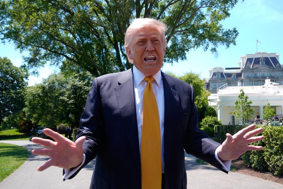 President Donald Trump speaks to reporters as he leaves the White House for travel to Beijing, Tuesday, May 12, 2026, in Washington, to meet with China's President Xi Jinping. (AP Photo/Manuel Ba ...