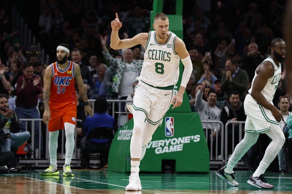Boston Celtics&#039; Kristaps Porzingis heads back upcourt after making a 3-point basket against the Oklahoma City Thunder during the second half of an NBA basketball game Wednesday, April 3, 2024, in ...