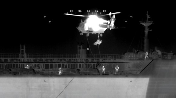 epaselect epa12786885 A handout photo made available by the Belgian Defense Ministry on 01 March 2026 shows Belgian army intercepting and boarding oil tanker Ethera, registered in Guinea (IMO: 9387279 ...