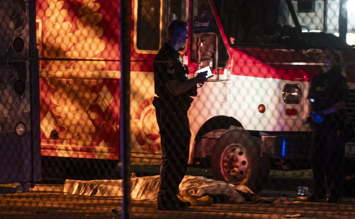 A victim lies near a food truck after a car drove into a crowd at the Lapu Lapu Festival in Vancouver on Saturday April 26, 2025. (Rich Lam/The Canadian Press via AP)
Canada Festival Deaths Vancouver