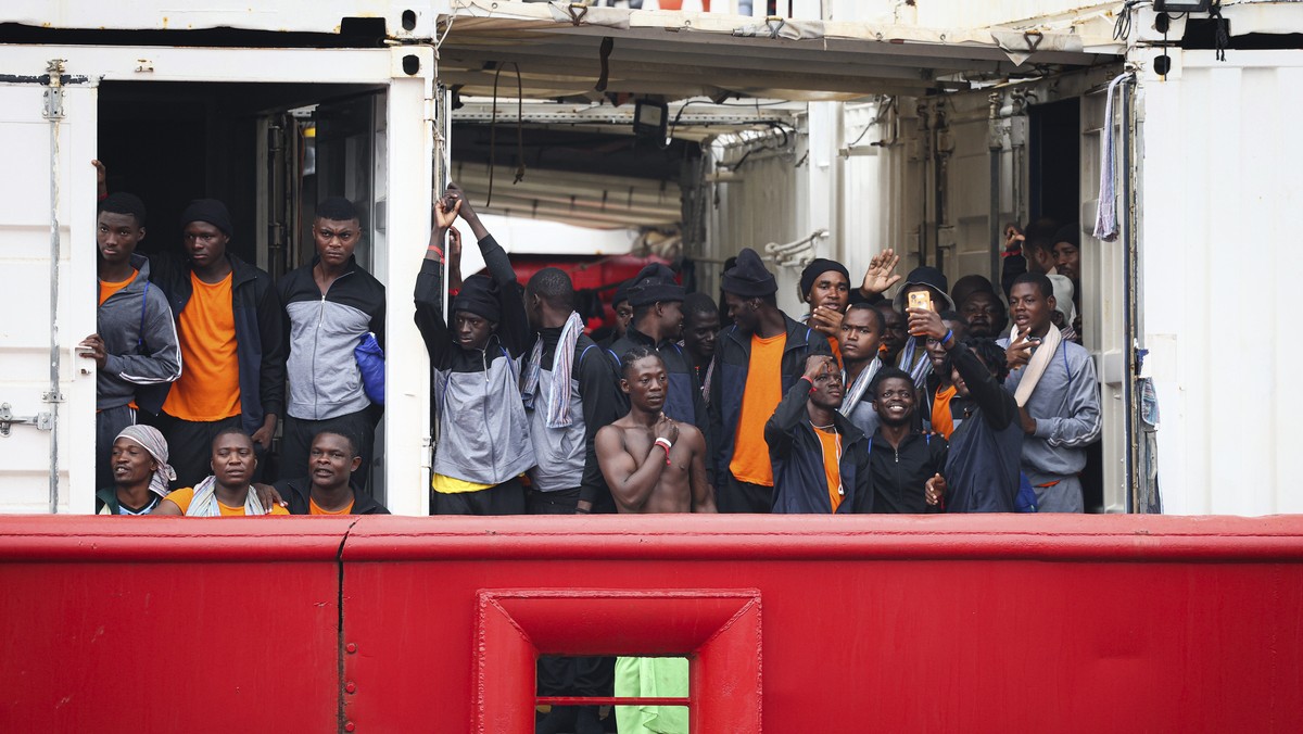 A view of migrants on board the Ocean Viking ship arriving at Naples port pier 21, in Naples, Italy, Monday, Aug. 28, 2023. (Alessandro Garofalo /LaPresse via AP)