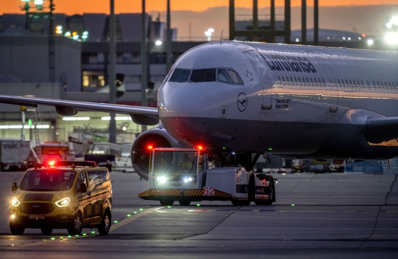 A Lufthansa aircrafts is pulled to a park position at the airport in Frankfurt, Germany, Friday, Sept.2, 2022. Hundreds of Lufthansa flights have been canceled as pilots stage a one-day strike to pres ...