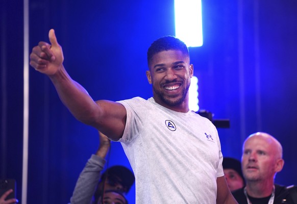 Boxer Anthony Joshua gestures during the weigh-in at Trafalgar Square in London, Friday, Sept. 20, 2024, for their upcoming IBF heavyweight title fight agains Daniel Dubois. (Bradley Collyer/PA via AP ...