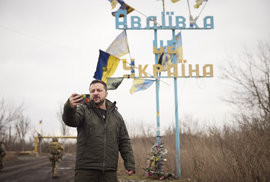 epa11048547 A handout picture made available by the Presidential Press Service shows Ukrainian President Volodymyr Zelensky recording his video address in front of the sign &#039;Avdiivka is Ukraine&# ...