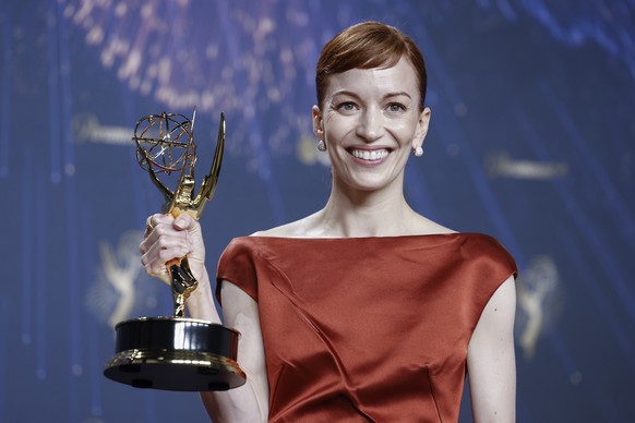 epa12378260 US actor Britt Lower, winner of the award for outstanding lead actress in a drama series for &#039;Severance,&#039; poses with their award in the press room during the 77th annual Emmy Awa ...