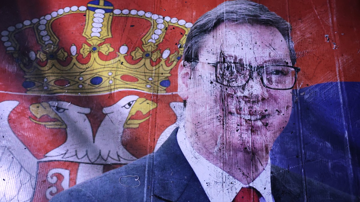 KEYPIX - A defaced poster of Aleksandar Vucic, leader of the right-wing Serbian Progressive Party (SNS), lies on the pavement outside the National Assembly, after he conceded defeat in the parliamenta ...
