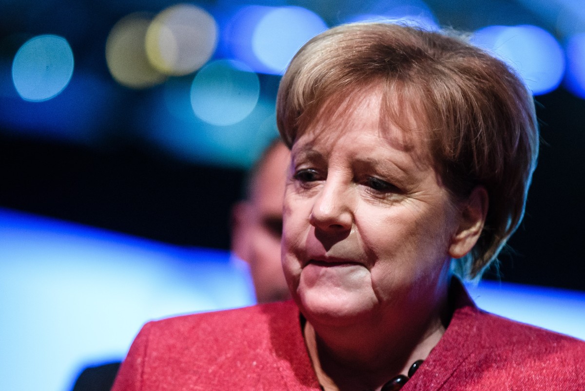 epa07182584 German Chancellor Angela Merkel leaves after her speech at the Day of the Employers conference in Berlin, Germany, 22 November 2018. The Confederation of German Employers' Association ...
