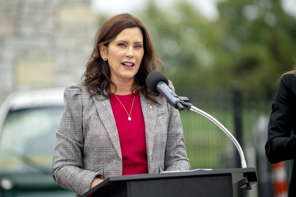FILE - Michigan Gov. Gretchen Whitmer announces the first round of Michigan Mobility Funding Platform grants on Sept. 15, 2021, at the GM Mobility Research Center at Kettering University in Flint, Mic ...