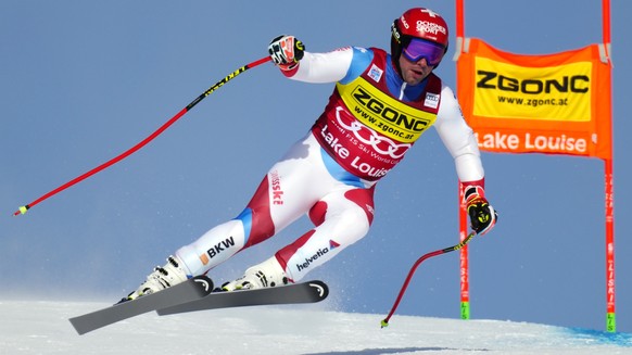 Beat Feuz of Switzerland flies down the course during the second Men's World Cup downhill training run in Lake Louise, Alberta, Wednesday, Nov. 24, 2021. (Frank Gunn/The Canadian Press via AP)