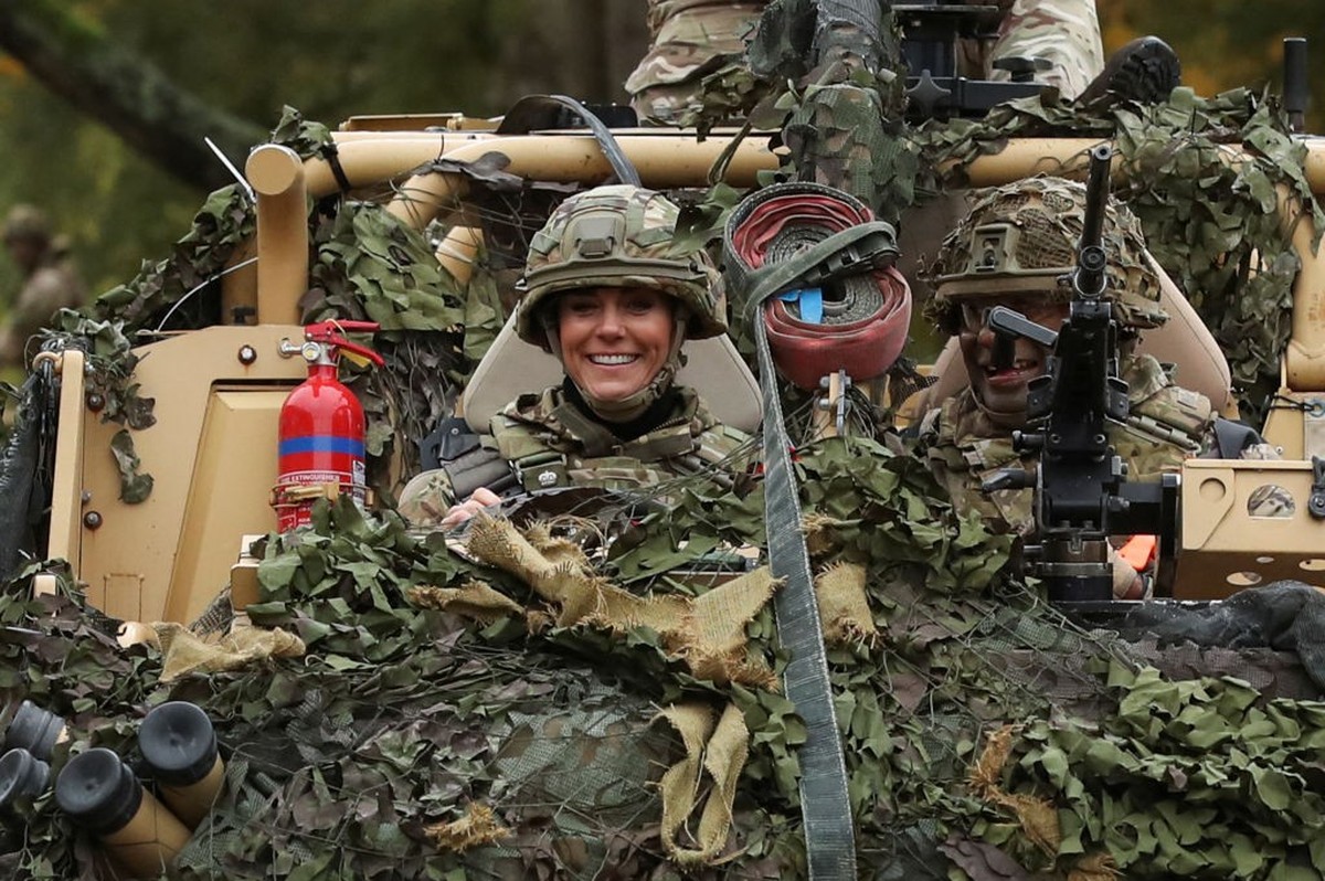 DEREHAM, ENGLAND - NOVEMBER 8: Catherine, Princess of Wales drives an armoured vehicle as she visits The Queen's Dragoon Guards Regiment for the first time as their Colonel in Chief on November 8 ...
