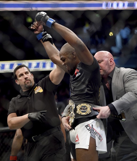 UFC President Dana White puts the UFC light heavyweight champion belt on Jon Jones after he defeated Daniel Cormier during UFC 214 in Anaheim, Calif., Saturday July 29, 2017. (Hans Gutknecht /Los Ange ...