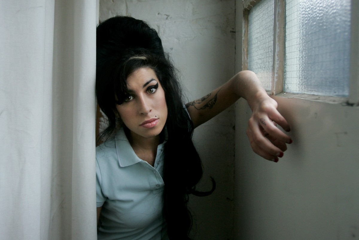 FILE - In this Feb. 16, 2007 file photo, British singer Amy Winehouse poses for a photograph at a studio in north London, Friday, Feb. 16, 2007. Rock 'n' roll will never die, but it's a ...